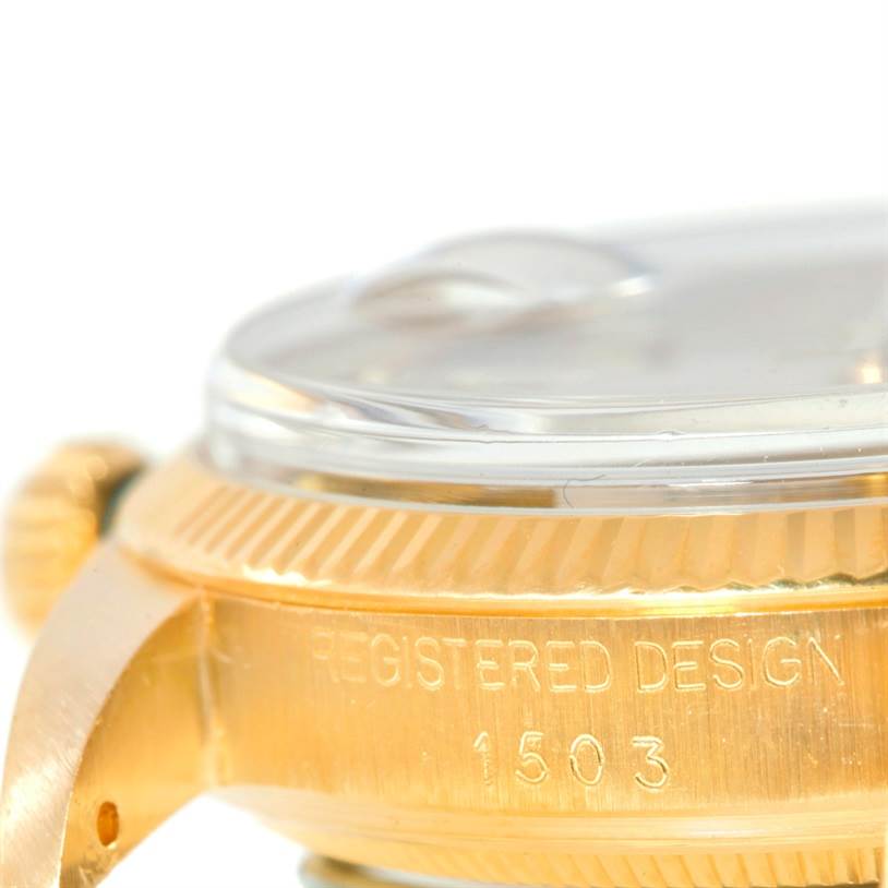 The image shows a close-up side view of the Rolex President 1503 Men
s Yellow Gold Silver Dial 1503 Men
s Yellow Gold Silver Dial model watch, highlighting the crown, bezel, and part of the case with "REGISTERED DESIGN 1503" engraving.