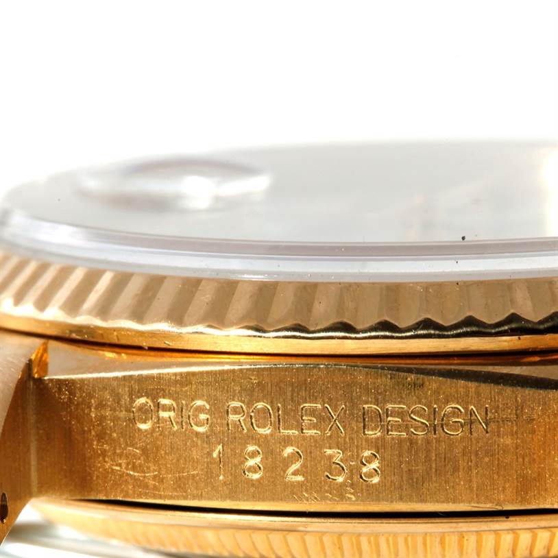 This image shows a close-up side view of the bezel, crystal, and case of a Rolex President 18238 Men's Yellow Gold White Dial 18238 Men's Yellow Gold White Dial model watch.