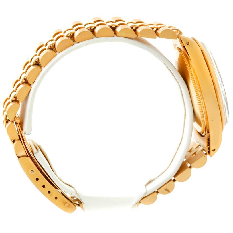 This image shows a side view of a Rolex President 1503 Men
s Yellow Gold Champagne Dial 1503 Men
s Yellow Gold Champagne Dial model watch, highlighting its gold bracelet and case.