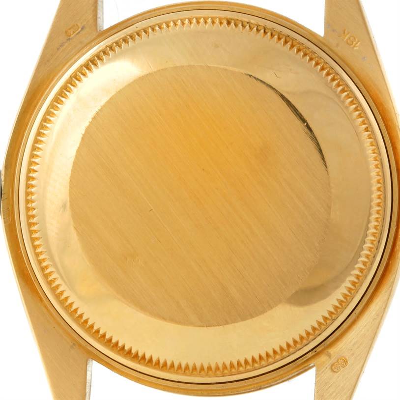 The image shows a close-up of the back case of a Rolex President 1503 Men
s Yellow Gold Champagne Dial 1503 Men
s Yellow Gold Champagne Dial model watch.