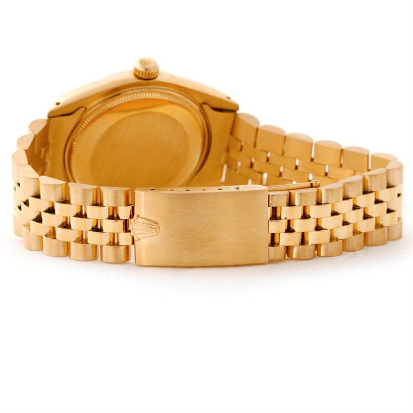 The image shows the back and bracelet of a Rolex President 1503 Men
s Yellow Gold Champagne Dial 1503 Men
s Yellow Gold Champagne Dial model watch from a straight-on angle.