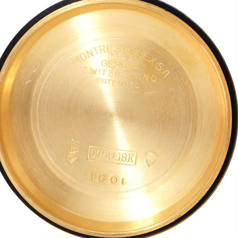 This is a close-up of the inner case back of a Rolex President 1601 Men's Yellow Gold White Dial 1601 Men's Yellow Gold White Dial model watch, showing engravings and markings including "Geneva Switzerland" and "18K".