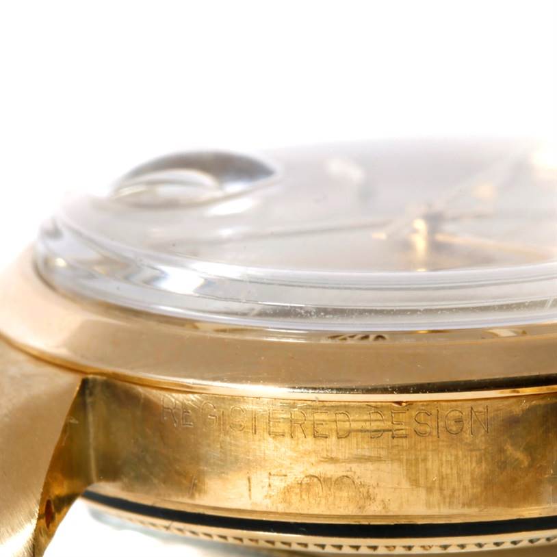 This image shows a side view of the case and crystal of a Rolex President 1500 Men
s Yellow Gold Champagne Dial 1500 Men
s Yellow Gold Champagne Dial model watch.