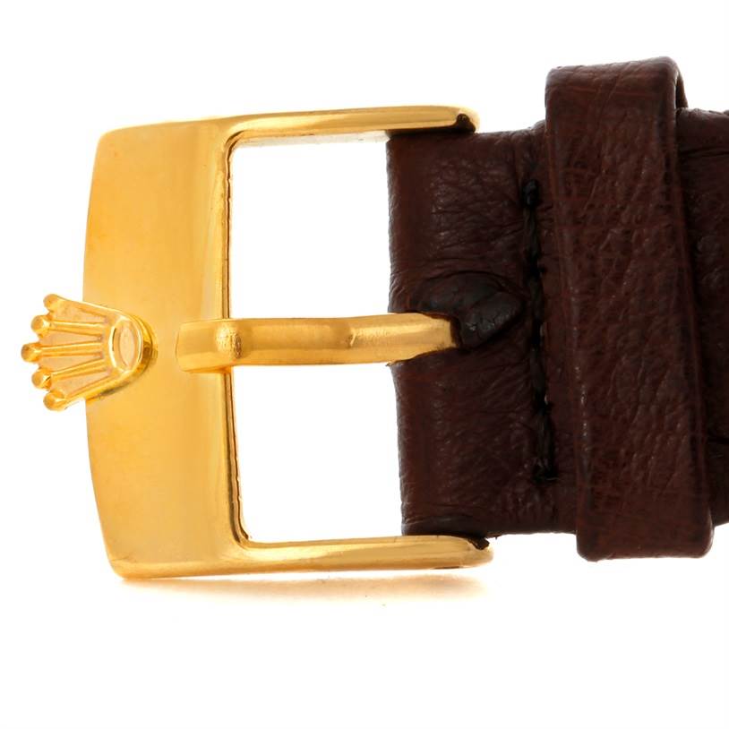 The image shows a close-up of the buckle and leather strap of a Rolex President 1500 Men
s Yellow Gold Champagne Dial 1500 Men
s Yellow Gold Champagne Dial watch.