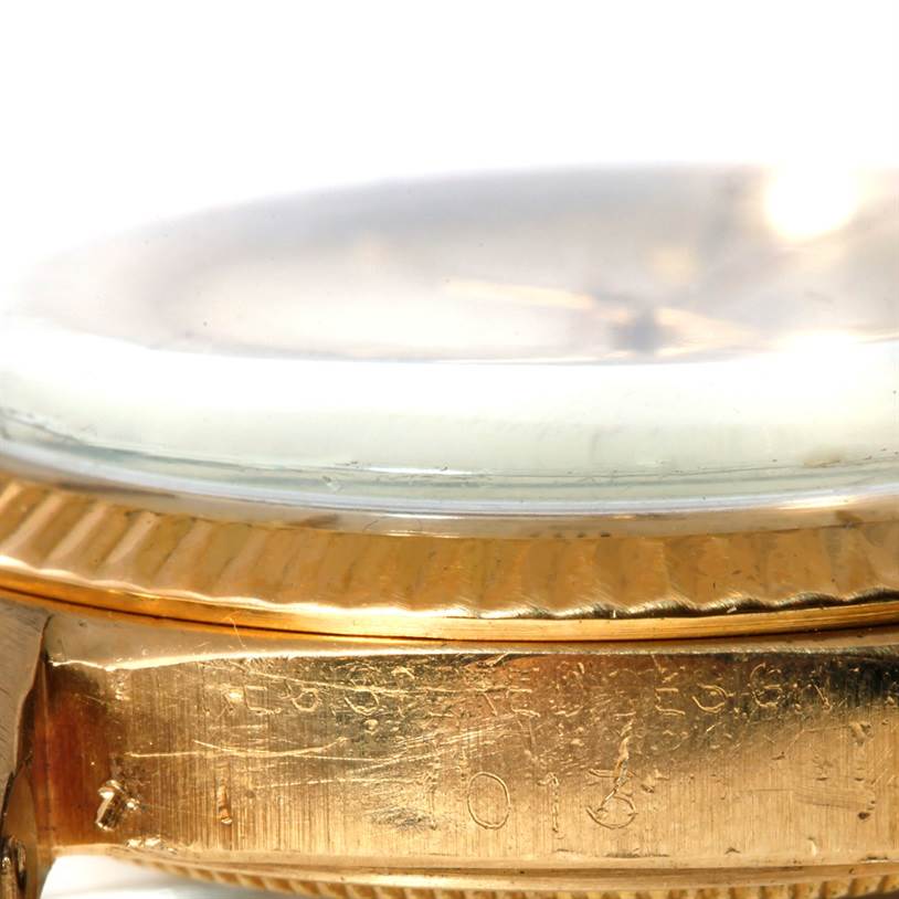 This image shows a close-up side view of the case and bezel of a Rolex President 1013 Men
s Yellow Gold Champagne Dial 1013 Men
s Yellow Gold Champagne Dial model watch.