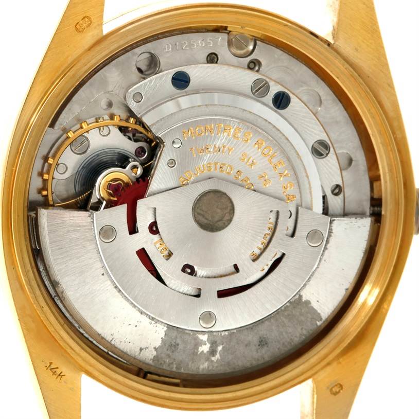 This image shows the inner mechanical parts of a Rolex President 1503 Men
s Yellow Gold Champagne Dial 1503 Men
s Yellow Gold Champagne Dial model watch from a back view, highlighting its movement and inscriptions.