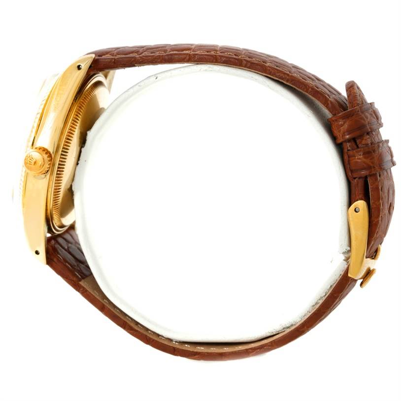 The image shows a side view of a Rolex President 1503 Men
s Yellow Gold Champagne Dial 1503 Men
s Yellow Gold Champagne Dial watch, highlighting the crown, case, and brown leather strap.