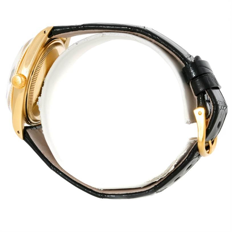 This image shows a side view of the Rolex President 1503 Men's Yellow Gold Silver Dial 1503 Men's Yellow Gold Silver Dial model watch, highlighting the gold case and black leather strap.