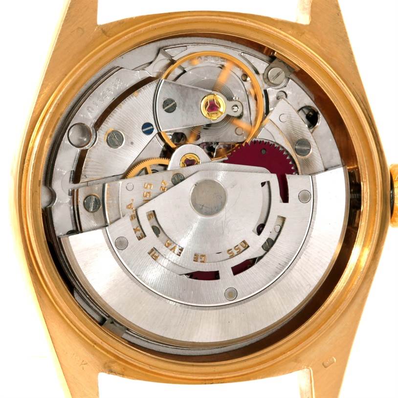 The image shows the inner mechanics and movement of a Rolex President 18038 Men's Yellow Gold Blue Dial 18038 Men's Yellow Gold Blue Dial model watch from a case-back removed angle.