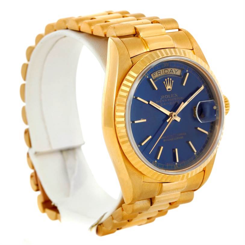 The Rolex President 18038 Men's Yellow Gold Blue Dial 18038 Men's Yellow Gold Blue Dial model watch is shown at a slight angle, displaying its gold bracelet, blue dial, and fluted bezel.