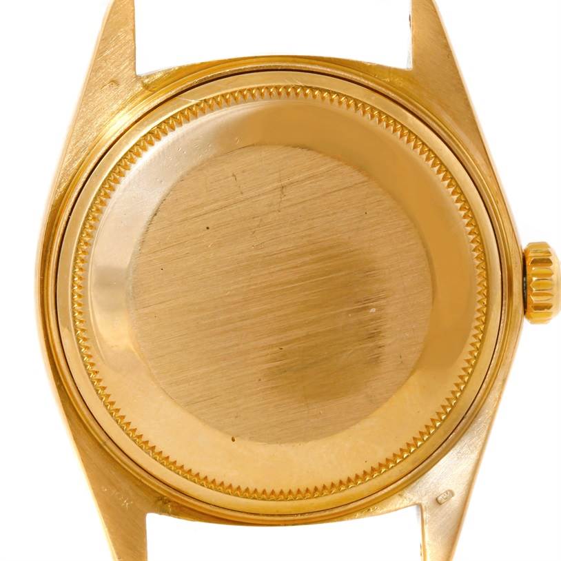 This image shows the back case of a Rolex President 18038 Men's Yellow Gold Blue Dial 18038 Men's Yellow Gold Blue Dial model watch, including its crown and lugs, viewed from the back.