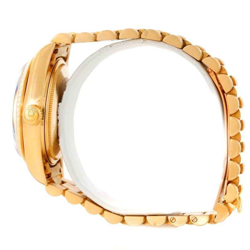 The image shows a side profile of a Rolex President 18038 Men's Yellow Gold Blue Dial 18038 Men's Yellow Gold Blue Dial model watch highlighting its gold case, crown, and bracelet.