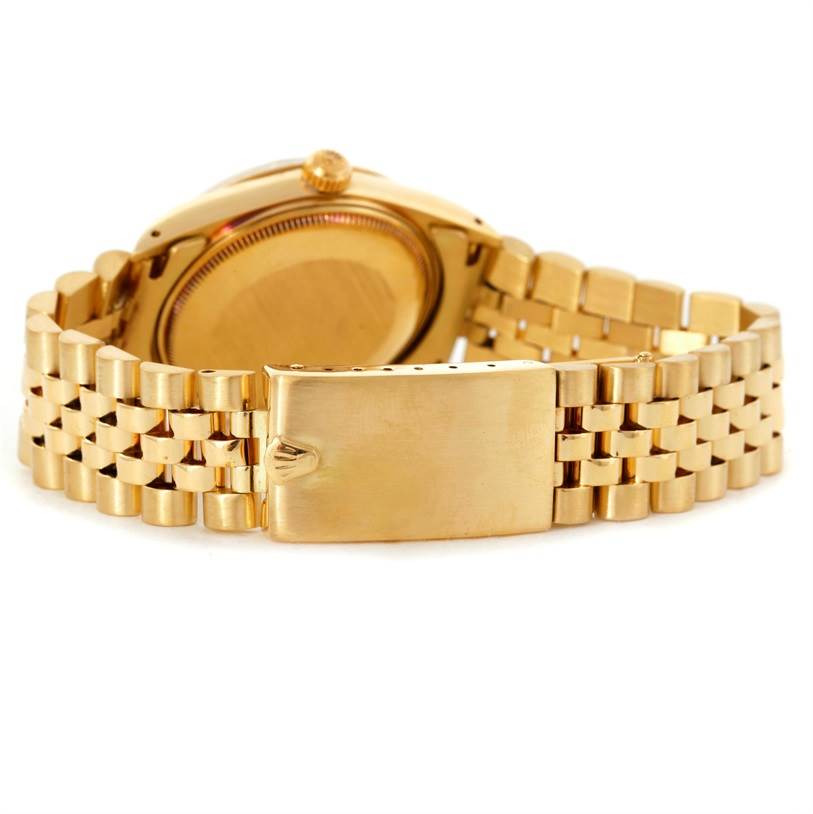 This image shows the back of the Rolex President 15037 Men
s Yellow Gold Champagne Dial 15037 Men
s Yellow Gold Champagne Dial model watch, highlighting its clasp, bracelet, and case back.