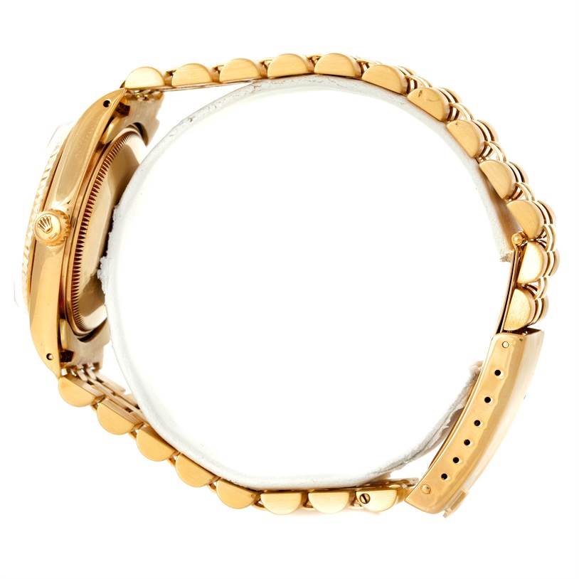 The image shows a side view of a Rolex President 15037 Men
s Yellow Gold Champagne Dial 15037 Men
s Yellow Gold Champagne Dial model watch, highlighting its gold case, crown, and bracelet.