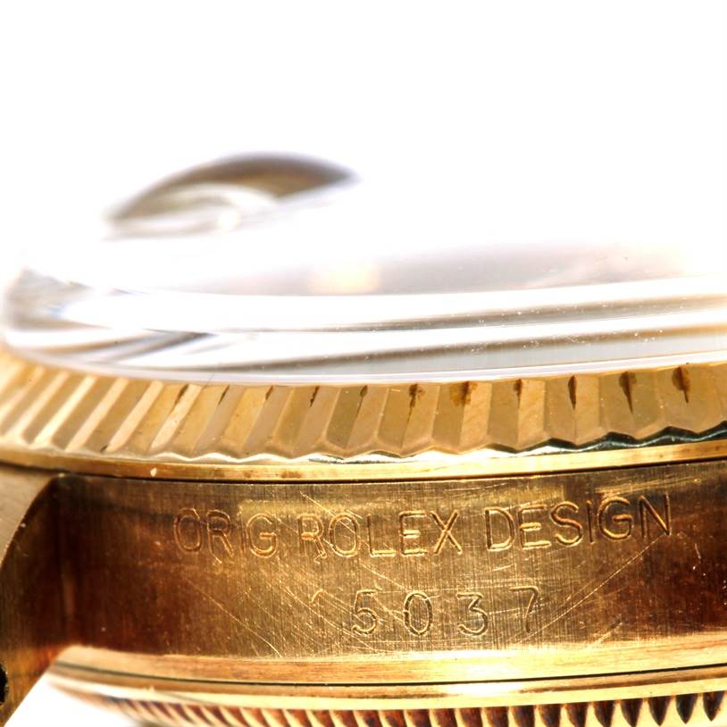 The image shows a close-up side angle of the crystal and bezel of a Rolex President 15037 Men
s Yellow Gold Champagne Dial 15037 Men
s Yellow Gold Champagne Dial watch, revealing its model number.