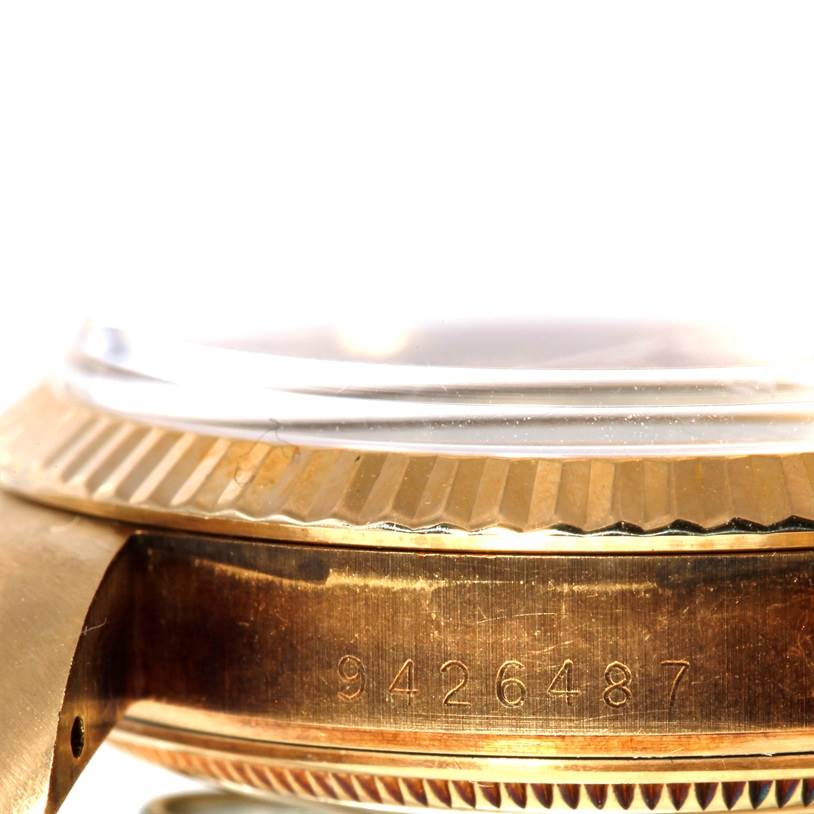 The image shows a side angle view of a Rolex President 15037 Men
s Yellow Gold Champagne Dial 15037 Men
s Yellow Gold Champagne Dial model featuring the case number and part of the bezel.