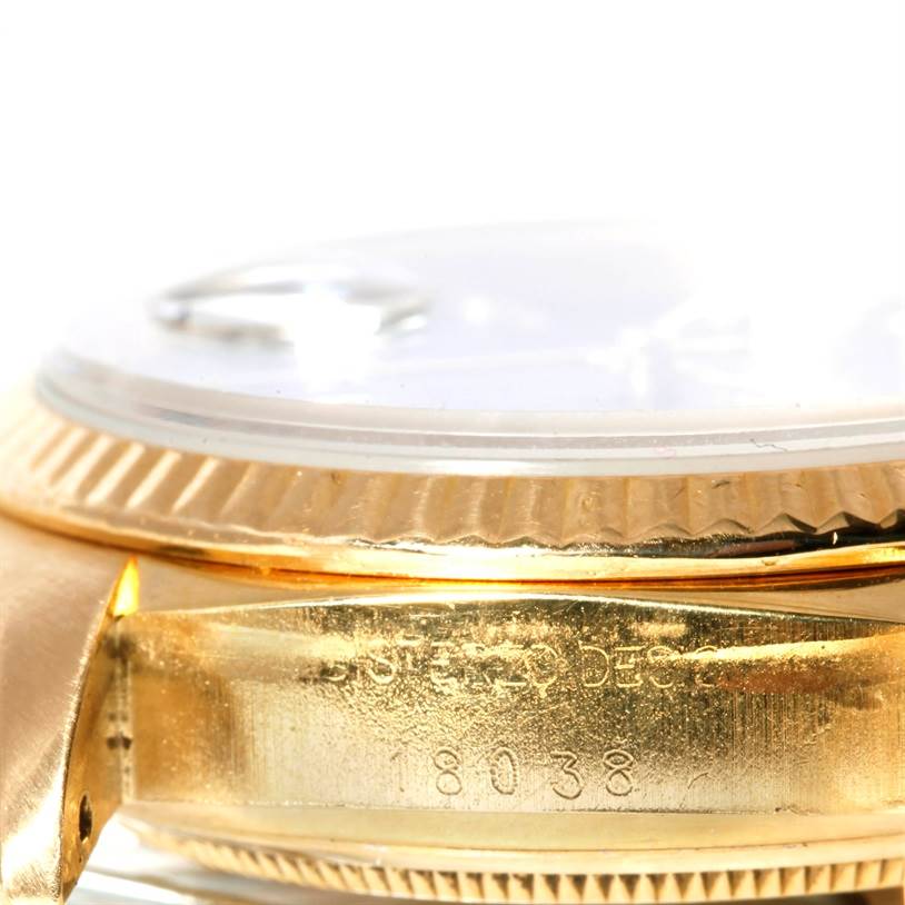 The image shows a close-up, side view of the case and bezel of a Rolex President 18038 Men's Yellow Gold Black Dial 18038 Men's Yellow Gold Black Dial model watch.
