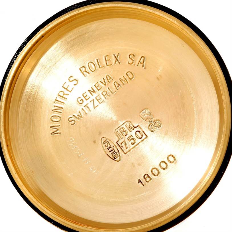 This is the inside case back of a Rolex President 18038 Men's Yellow Gold Black Dial 18038 Men's Yellow Gold Black Dial model, showcasing inscriptions and hallmarks.