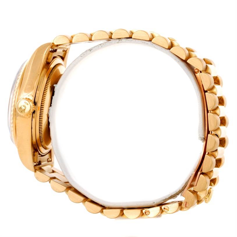 The image shows a side view of a Rolex President 18038 Men's Yellow Gold Black Dial 18038 Men's Yellow Gold Black Dial watch, highlighting its gold case and bracelet.