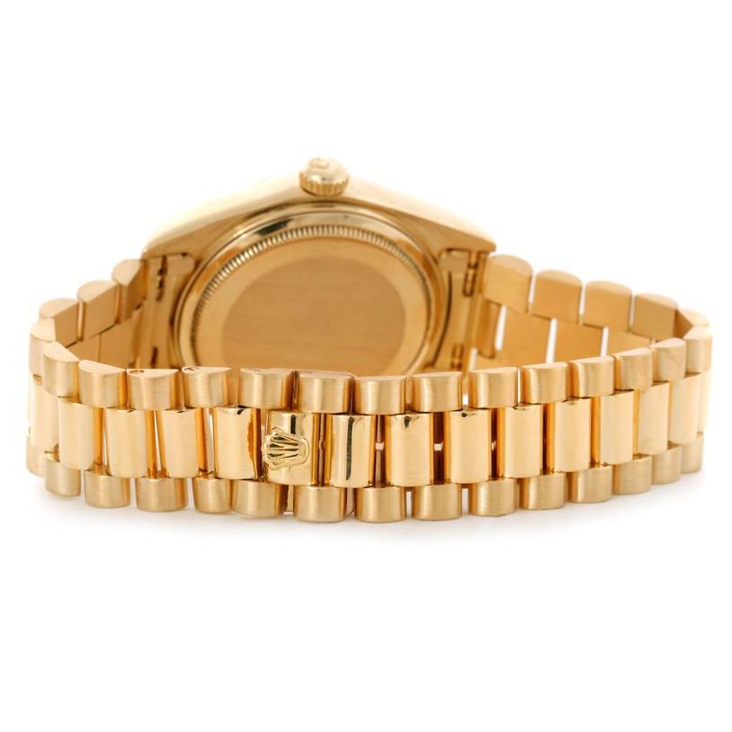 This image shows the back case and gold bracelet of a Rolex President 18038 Men's Yellow Gold Black Dial 18038 Men's Yellow Gold Black Dial model watch from a rear angle.