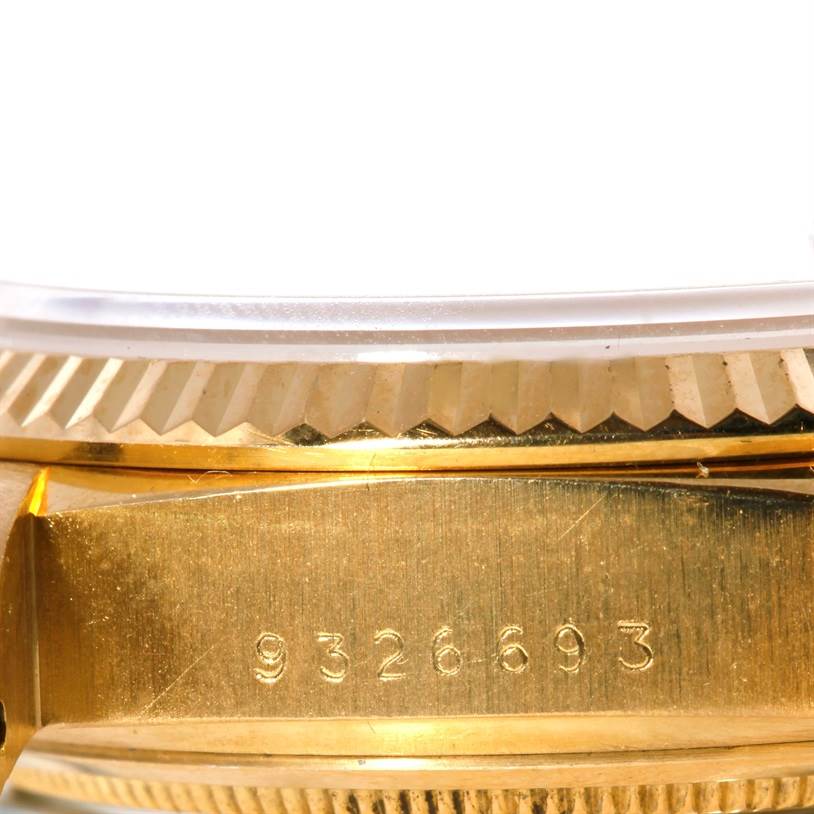 This close-up image shows the serial number engraved on the case side underneath the bezel of a Rolex President 18038 Men
s Yellow Gold White Dial 18038 Men
s Yellow Gold White Dial model watch.