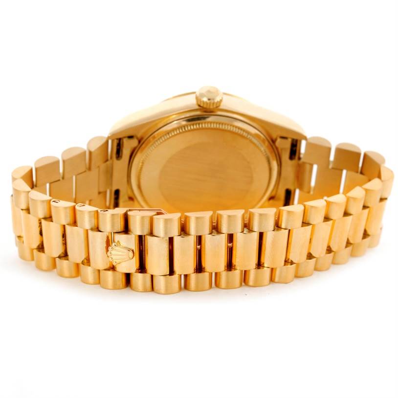 The image shows the back view of a Rolex President 18038 Men
s Yellow Gold White Dial 18038 Men
s Yellow Gold White Dial model watch, highlighting its bracelet and clasp.
