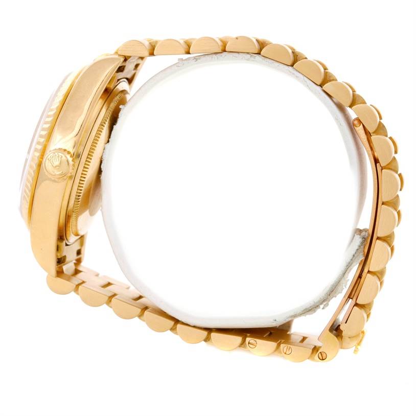 The image shows a side profile of a Rolex President 18038 Men
s Yellow Gold White Dial 18038 Men
s Yellow Gold White Dial model, highlighting the crown, case, and bracelet.