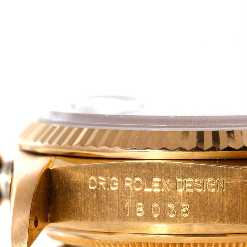 This close-up image of a Rolex President 18038 Men's Yellow Gold Blue Dial 18038 Men's Yellow Gold Blue Dial model watch shows the side profile featuring the case and the engraved serial number.