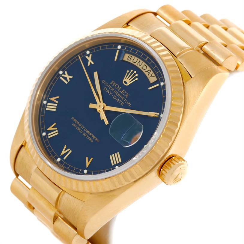 This image shows a side perspective of a Rolex President 18038 Men's Yellow Gold Blue Dial 18038 Men's Yellow Gold Blue Dial watch, displaying its blue dial, day-date window, and gold bracelet.