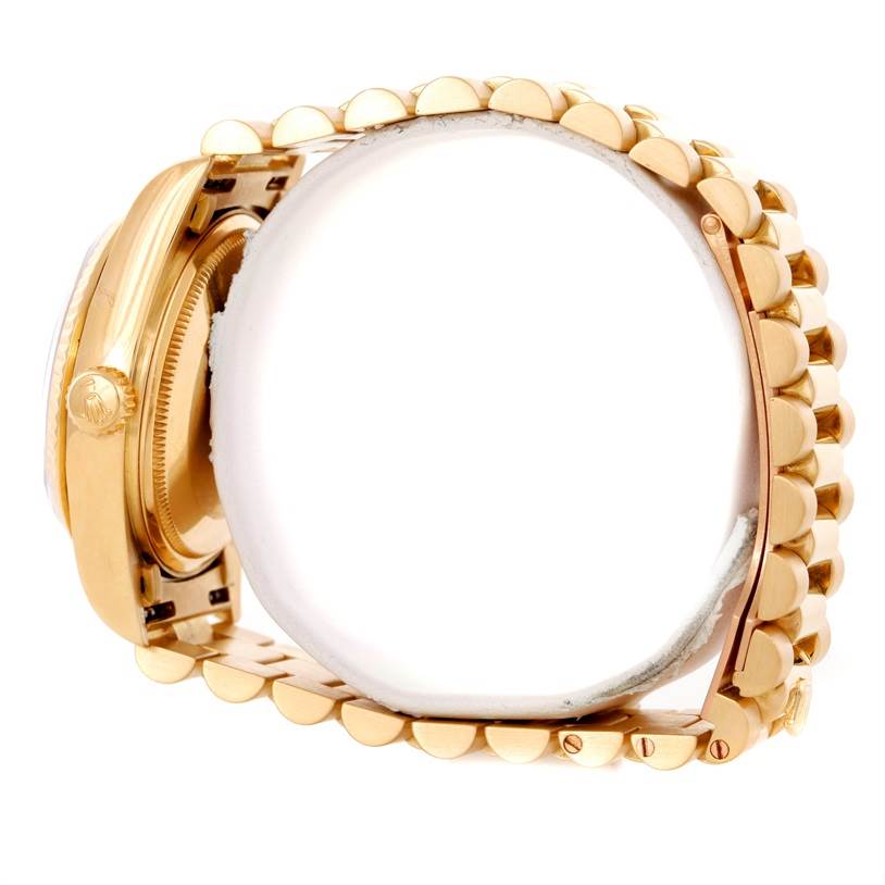 The image shows a side angle of the Rolex President 18038 Men's Yellow Gold Blue Dial 18038 Men's Yellow Gold Blue Dial model watch, highlighting the gold case, crown, and bracelet links.