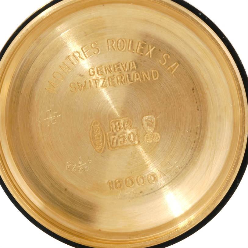 This is the inside of the case back for a Rolex President 18038 Men's Yellow Gold Blue Dial 18038 Men's Yellow Gold Blue Dial model watch, showing the brand, origin, and gold markings.