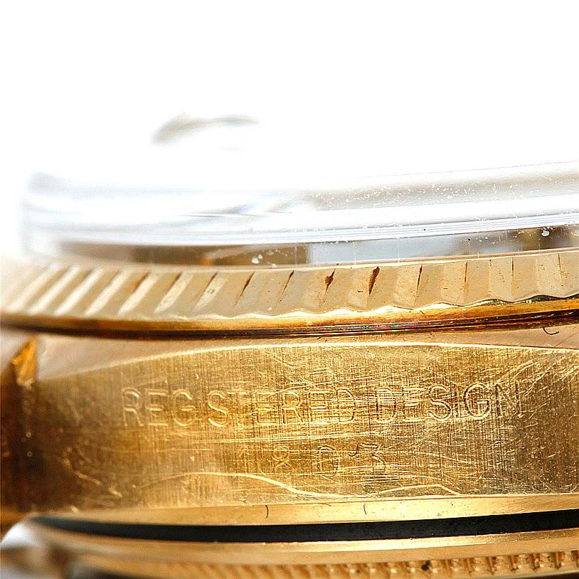This close-up angle shows the side of the case and bezel of the Rolex President 1803 Men's Yellow Gold Grey Dial 1803 Men's Yellow Gold Grey Dial model watch.