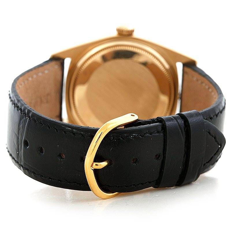 The image shows the back view of a Rolex President 1803 Men's Yellow Gold Grey Dial 1803 Men's Yellow Gold Grey Dial model watch, focusing on its case and black leather strap with a gold buckle.