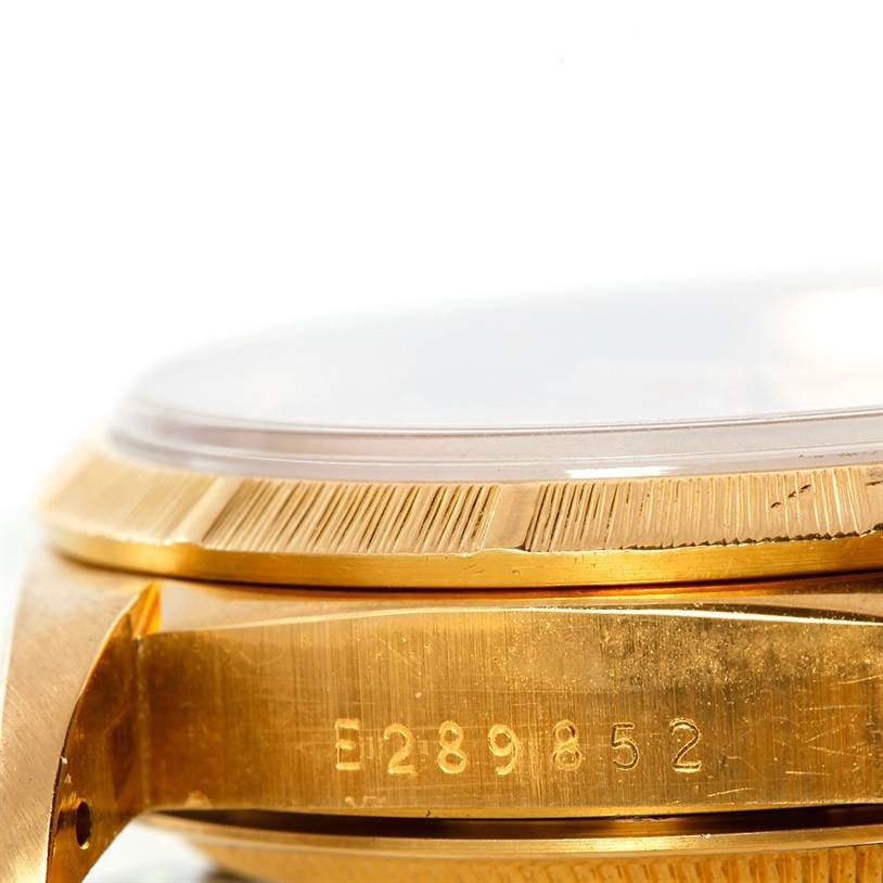 The image shows a close-up side view of the case and bezel, displaying the serial number of the Rolex President 18248 Men's Yellow Gold Champagne Dial 18248 Men's Yellow Gold Champagne Dial model watch.