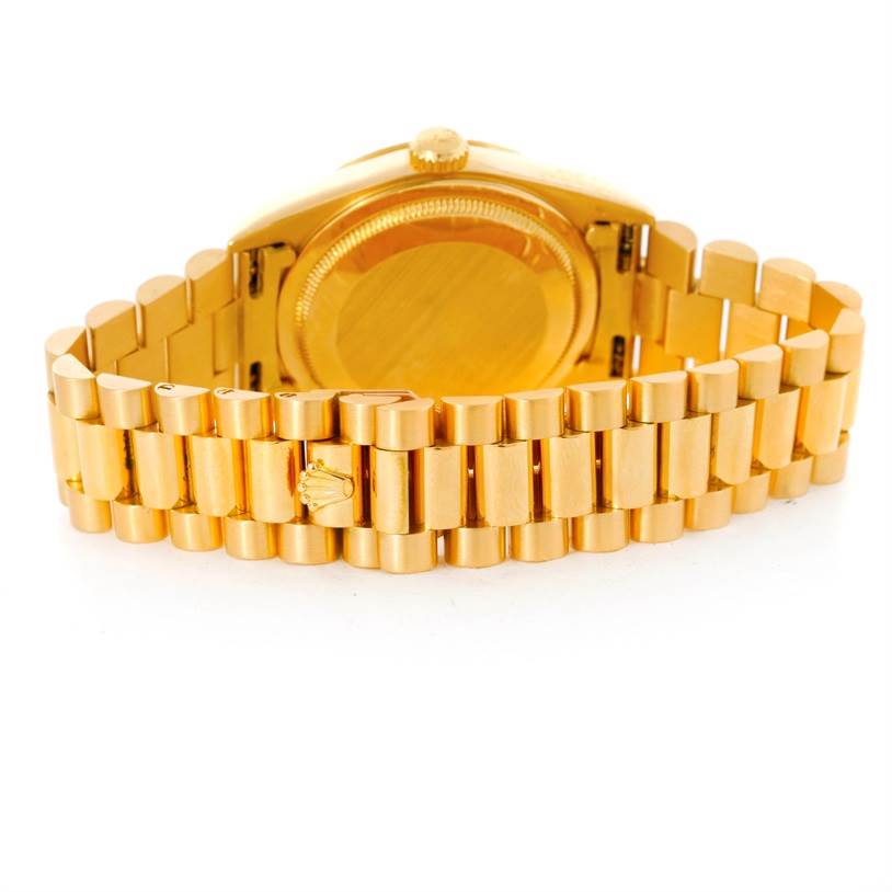 The image shows the backside and bracelet of a Rolex President 18248 Men's Yellow Gold Champagne Dial 18248 Men's Yellow Gold Champagne Dial model watch, highlighting its gold finish.