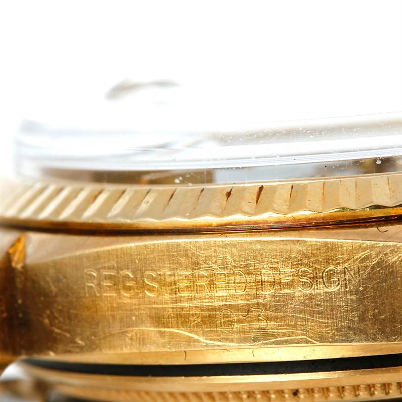 This close-up image shows the edge and side engraving of a Rolex President 1803 Men's Yellow Gold Grey Dial 1803 Men's Yellow Gold Grey Dial model watch.