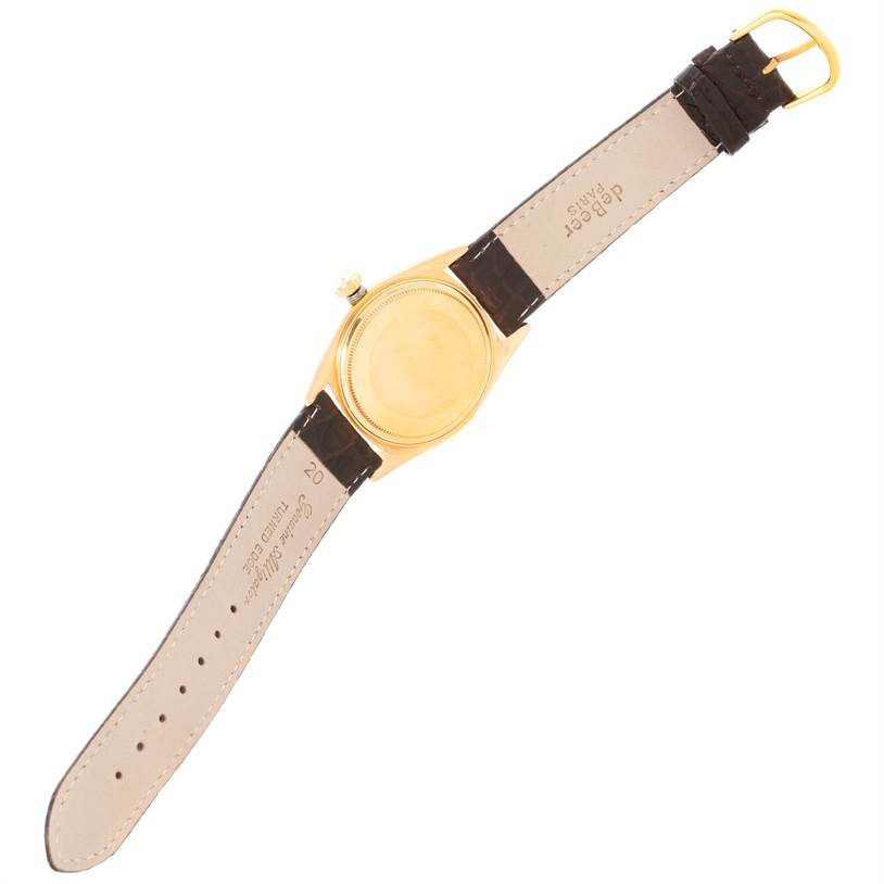 This image shows the back and strap of a Rolex President 1803 Men's Yellow Gold Grey Dial 1803 Men's Yellow Gold Grey Dial model watch, laid flat with the caseback and buckle visible.