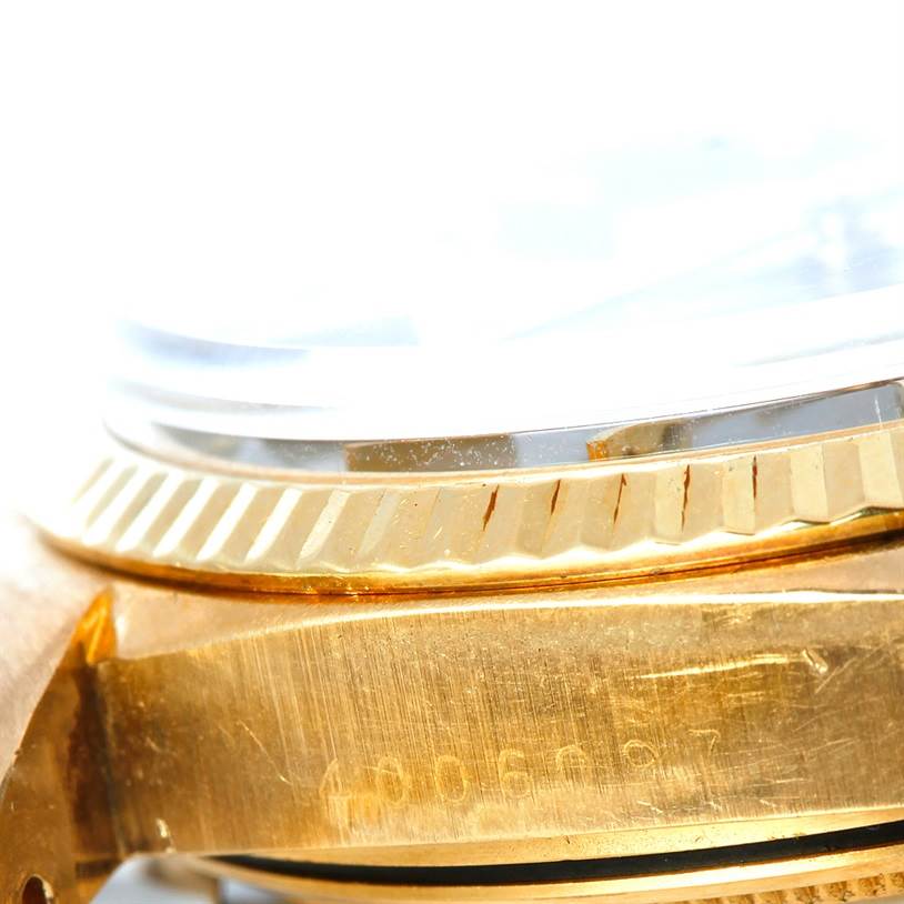 This close-up image shows the side view of the Rolex President 1803 Men's Yellow Gold Grey Dial 1803 Men's Yellow Gold Grey Dial model's case and bezel.