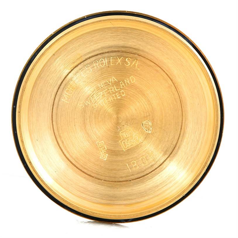 This image shows the inside of the case back of a Rolex President 1803 Men's Yellow Gold Grey Dial 1803 Men's Yellow Gold Grey Dial watch, revealing brand engravings and hallmarks.