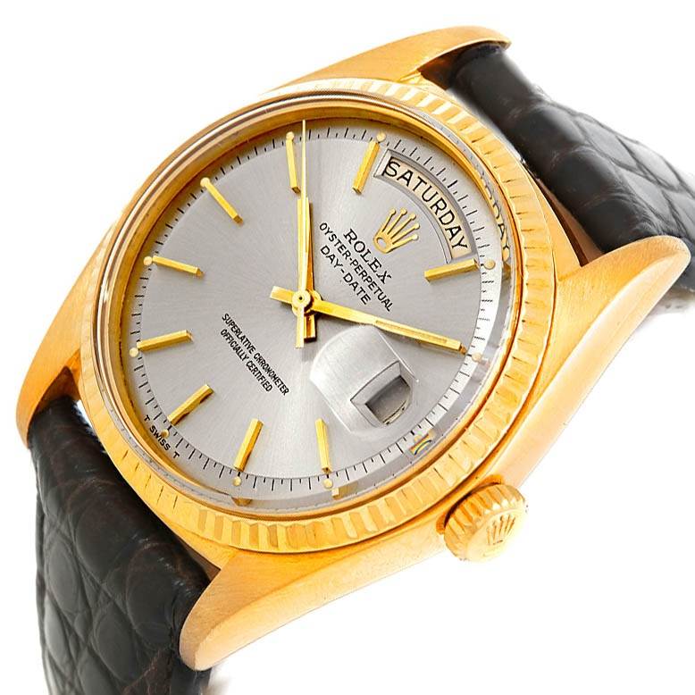 This image shows a close-up of a Rolex President 1803 Men's Yellow Gold Grey Dial 1803 Men's Yellow Gold Grey Dial watch, highlighting its dial, bezel, and leather strap at an angled view.