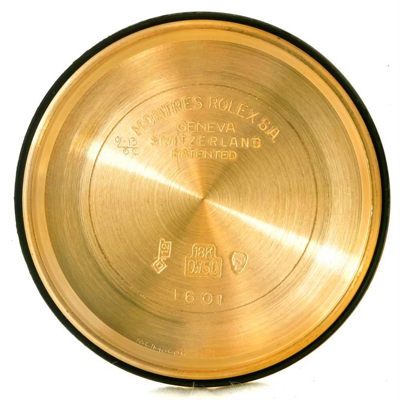 This image shows the inside of a Rolex President 1601 Men
s Yellow Gold Champagne Dial 1601 Men
s Yellow Gold Champagne Dial model watch case back engraved with the model number 1601 and other details.