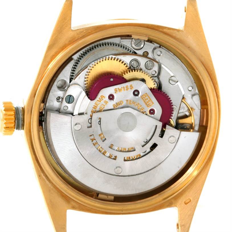 The image shows the internal mechanism of a Rolex President 1601 Men
s Yellow Gold Champagne Dial 1601 Men
s Yellow Gold Champagne Dial model watch from a rear view.