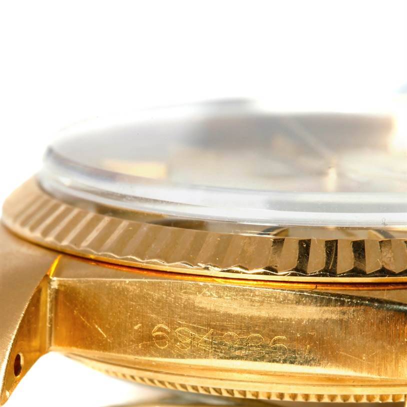 The image shows a close-up angled view of the case side and bezel of a Rolex President 1601 Men
s Yellow Gold Champagne Dial 1601 Men
s Yellow Gold Champagne Dial model watch.