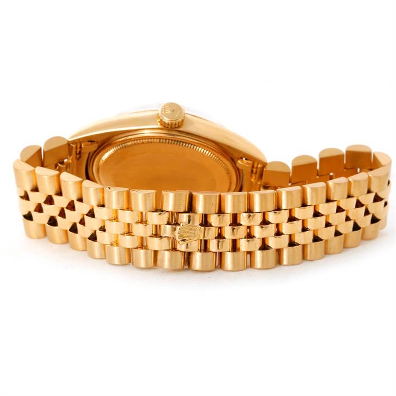 The image shows the back and bracelet of a Rolex President 1601 Men
s Yellow Gold Champagne Dial 1601 Men
s Yellow Gold Champagne Dial model watch from a rear angle.