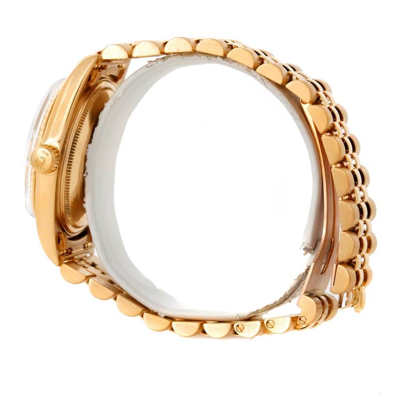 The image shows a side view of the Rolex President 1601 Men
s Yellow Gold Champagne Dial 1601 Men
s Yellow Gold Champagne Dial model, highlighting the crown, case, and bracelet links.