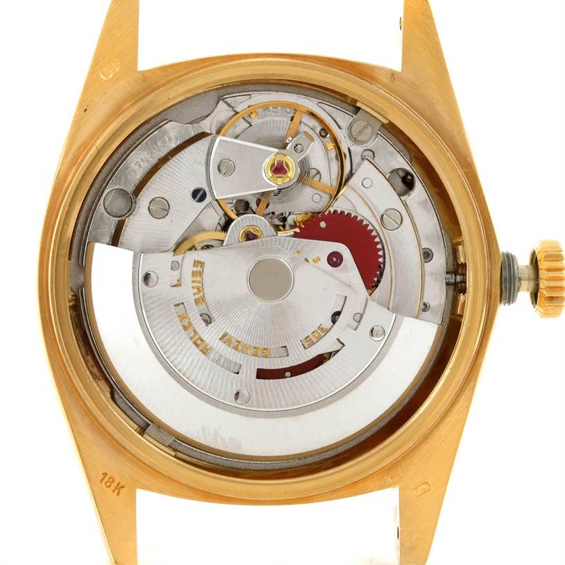 This image shows the movement mechanism of a Rolex President 18038 Men
s Yellow Gold Champagne Dial 18038 Men
s Yellow Gold Champagne Dial model watch from a back view, with the caseback removed.