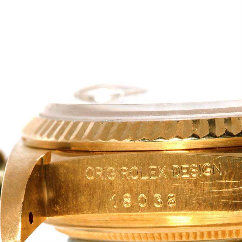 This image shows a close-up angle of the case side and bezel on a Rolex President 18038 Men
s Yellow Gold Champagne Dial 18038 Men
s Yellow Gold Champagne Dial model watch with the serial number engraved.