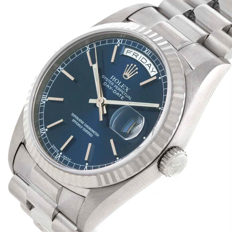 The image shows a close-up view from the side and top of a Rolex President 18239 Men's White Gold Blue Dial 18239 Men's White Gold Blue Dial model watch, highlighting its dial, bezel, and bracelet.