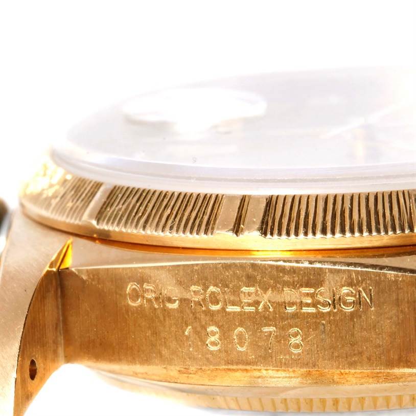 The image shows a close-up angle of a Rolex President 18078 Men
s Yellow Gold Champagne Dial 18078 Men
s Yellow Gold Champagne Dial watch, highlighting the bezel and case with the model number 18078.