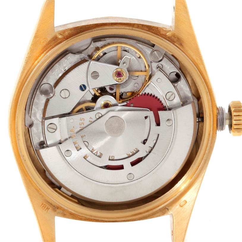This image shows the back view of the Rolex President 18078 Men
s Yellow Gold Champagne Dial 18078 Men
s Yellow Gold Champagne Dial model, displaying its movement and internal mechanisms.